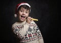 Child singing Christmas carol at Christmas Royalty Free Stock Photo