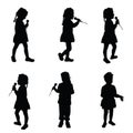 Child singing silhouette with microphone Royalty Free Stock Photo