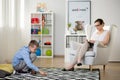 Child sits on carpet