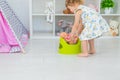 The child sits on the potty. Selective focus. Royalty Free Stock Photo