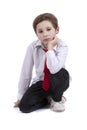 The child sits on a white background.