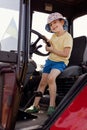 Child sitting in the cabin tractor