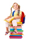 Child sitting on pile of books. Royalty Free Stock Photo