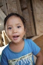 Child sitting on the step in the village