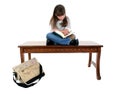 Child Sitting on Table Reading Book Royalty Free Stock Photo