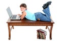 Child Sitting on Table Working On Laptop Royalty Free Stock Photo