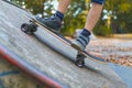 A child skates on a longboard at a ramp Royalty Free Stock Photo