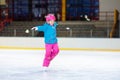 Child skating on indoor ice rink. Kids skate Royalty Free Stock Photo