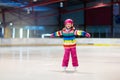 Child skating on indoor ice rink. Kids skate Royalty Free Stock Photo