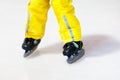 Child skating on indoor ice rink. Kids skate