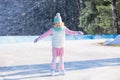 Child skating on natural ice. Kids with skates.