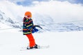 Child on ski lift. Kids skiing Royalty Free Stock Photo