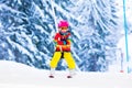 Child on ski lift in snow sport school in winter mountains Royalty Free Stock Photo