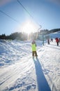 Child in ski lift in winter resort