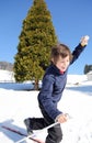 Child skiing falls with cross-country skis Royalty Free Stock Photo