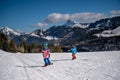 Child skiing in the snow. One Asian boy and girl snowboarding. Winter sport Royalty Free Stock Photo