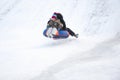 Sledding off a snow slide.Ski jumping on tubing. Royalty Free Stock Photo