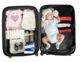 The child is sleeping in a suitcase on white background Royalty Free Stock Photo