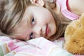 Child sleeping with teddy bear