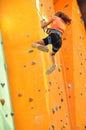 Child sliding down the climbing wall Royalty Free Stock Photo