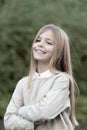 Child with smile on cute face outdoor. Little girl with long blond hair. Beauty kid with fresh look and skin. Beauty Royalty Free Stock Photo