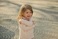 Child smile with hug hand gesture on sunny day Royalty Free Stock Photo