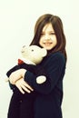 Child or smiling cute girl hugging cute, teddy bear toy Royalty Free Stock Photo