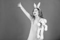 Child smiling play bunny toy. Happy childhood. Get in easter spirit. Bunny ears accessory. Lovely playful bunny child