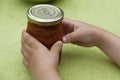 A child snatches the freshly made jam Royalty Free Stock Photo