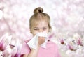 Child sneezing.Kid with tissue at nose, allergy concept
