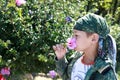 Child sniffing flower