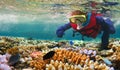 Child snorkeling in Great Barrier Reef Queensland Australia