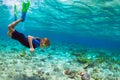 Child in snorkeling mask dive underwater in blue sea lagoon Royalty Free Stock Photo