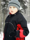 Child in the snow in warm clothes