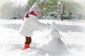 Child and snowman