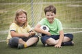 Child soccer football player. Boy with ball on green grass. Royalty Free Stock Photo