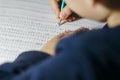 Child solves mathematics examples.