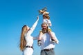 Child son with father and mother. Mom, dad and child boy with toy plane, holiday and togetherness. Children day. Child Royalty Free Stock Photo