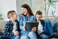 child son mother family happy playing kid childhood tablet laptop Royalty Free Stock Photo