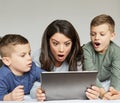 child son mother family surprised shocked amazed playing kid childhood tablet bed technology together mom parent Royalty Free Stock Photo