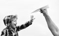 Child son playing with paper airplane. Carefree. Freedom to Dream - Joyful Boy Playing With Paper Airplane. Dream of Royalty Free Stock Photo