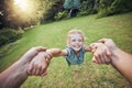 Child spinning from hands in park, pov and happy summer evening. Fun time, motion and girl in garden swinging from arms Royalty Free Stock Photo