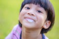 The child spit out saliva from his mouth. and making a cheeky face, playing dirty saliva close-up