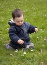 Child in spring grass Royalty Free Stock Photo