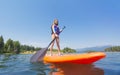 Child on a Stand Up Paddle board on a beautiful Mountain lake