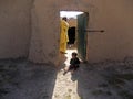 Child standing in front of a door in Afghanistan