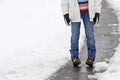 Child standing in a snowy street