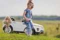 child standing near his car Royalty Free Stock Photo