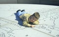 Child on a Stone Map