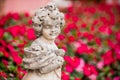 Child stone sculpture in garden